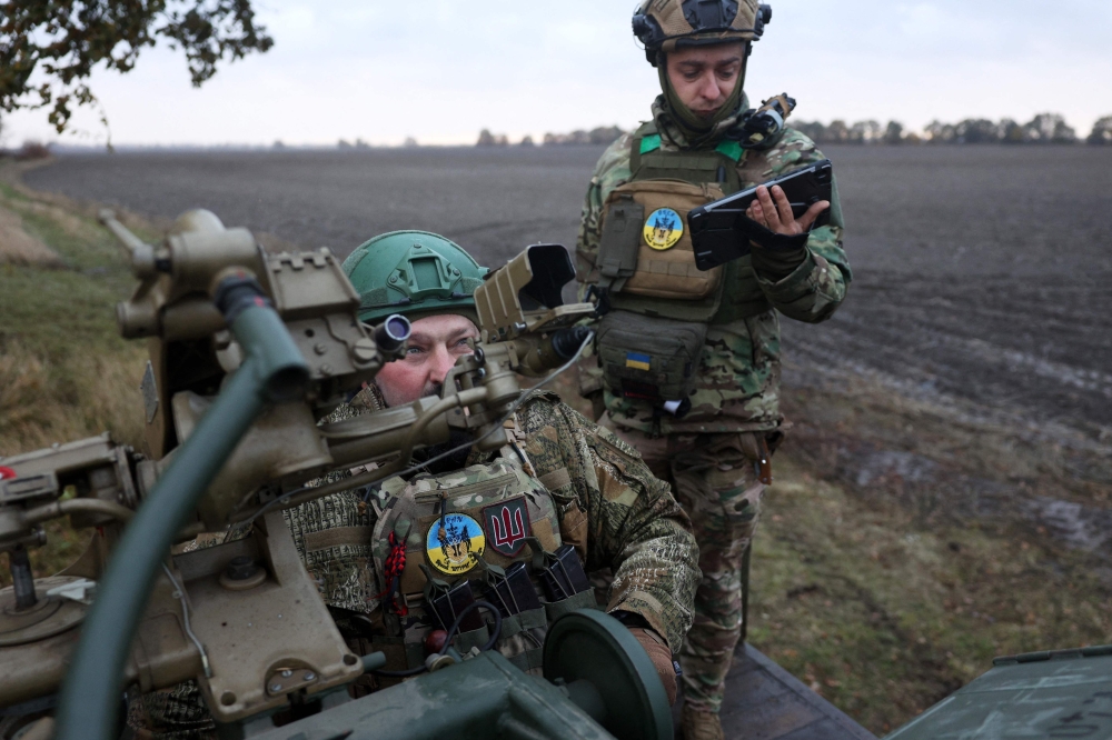 Ukrainian servicemen of Ukrainian Air Defence unit of the 241st separate brigade of the Territorial Defence Forces take part in a training in Kyiv. —AFP 