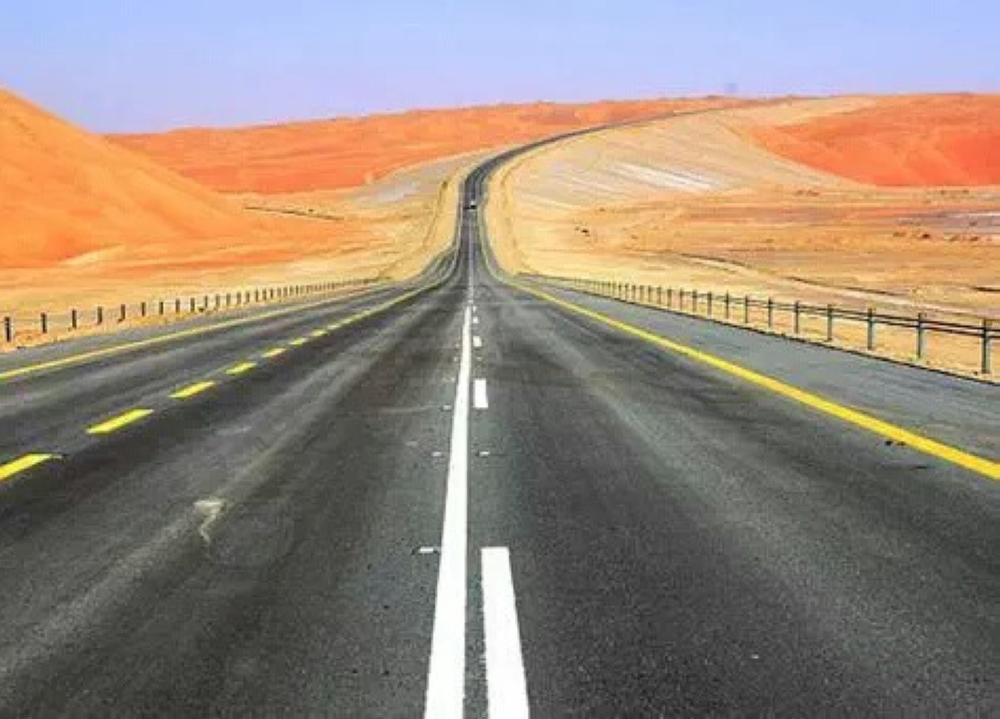 View of a section of the Oman-Saudi road cutting through the expansive Rub Al Khali desert.