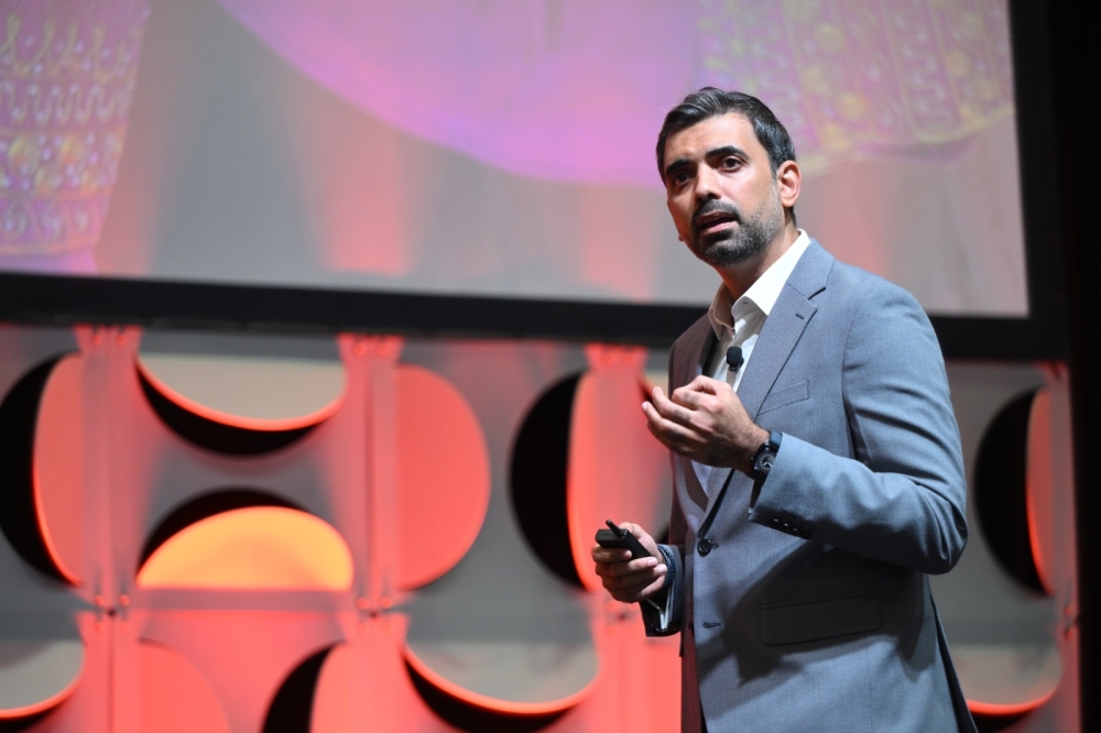 Mohammed al Eissa, Chief of Corporate Planning and Communication at Omran Group, speaks during the conference.
