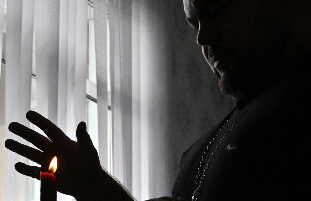 Ukrainian clairvoyant Sergiy Kobzar, who took part in the Ukrainian version of the "Battle of the Psychics" reality show, in an hotel room in Kyiv. - AFP
