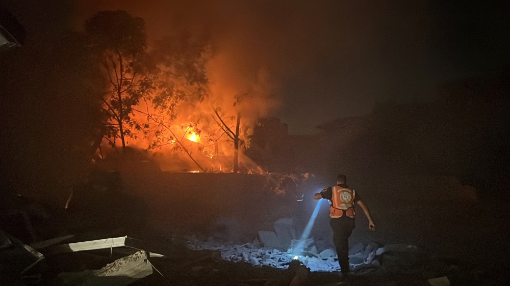 A Palestinian rescuer works at the site of an Israeli strike on a house in Gaza City. — Reuters 