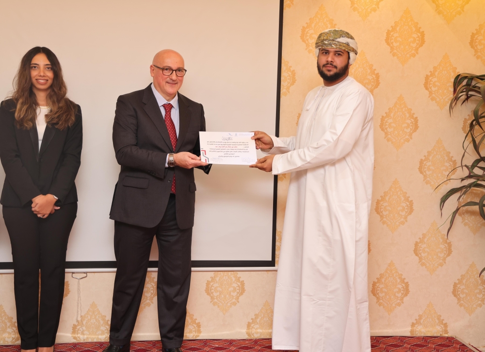 Giovanni Napolitano receives a certificate of appreciation.