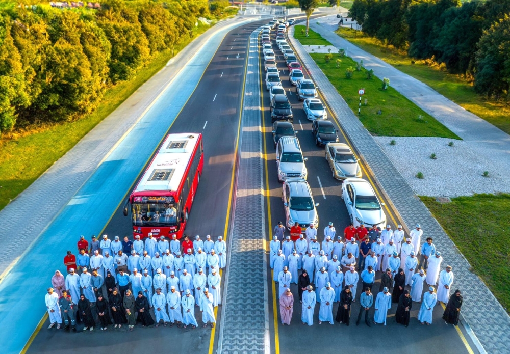 A Mwasalat bus is seen (left), with the same amount of people with their cars, in this illustration image.
