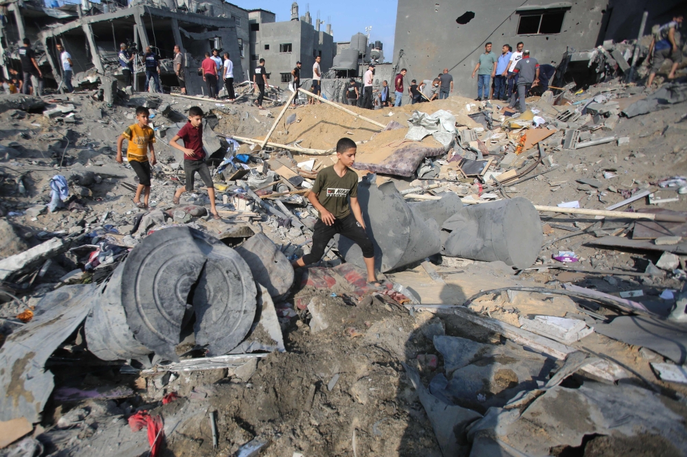 Palestinians check the destruction aftermath of an Israeli strike in the Jabalia camp for Palestinian refugees in the Gaza Strip. — AFP