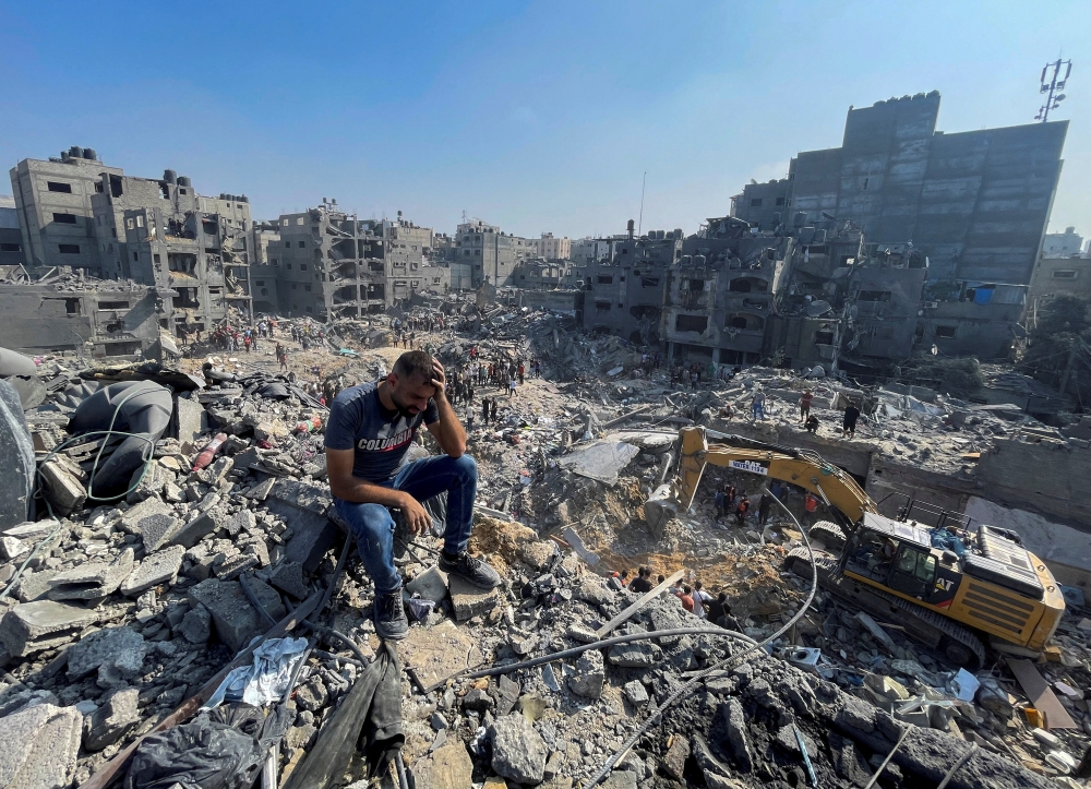 Palestinians search for casualties a day after Israeli strikes on houses in Jabalia refugee camp on Wednesday. — Reuters