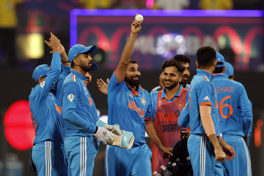 India's Mohammed Shami celebrates his five-wicket-haul after taking the wicket of Sri Lanka's Kasun Rajitha, caught by Shubman Gill REUTERS