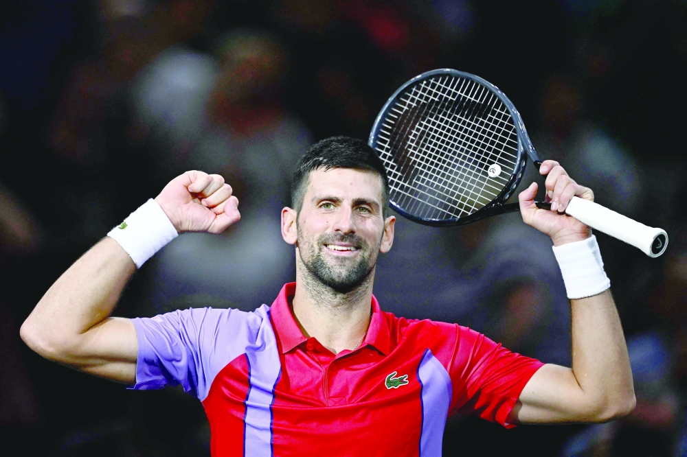 Serbia’s Novak Djokovic celebrates after beating Argentina’s Tomas Martin Etcheverry in the Paris ATP Masters. — AFP