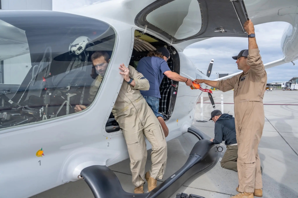 The pilot, Chris Caputo, right, said, “We’re doing some really meaningful work for our state, our country and the planet, It’s hard not to want to be a part of it.”

