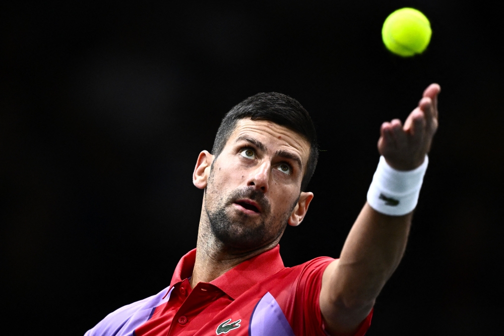 TOPSHOT - Serbia's Novak Djokovic serves to Netherlands' Tallon Griekspoor during their men's singles match on day four of the Paris ATP Masters 1000 tennis tournament at the Accor Arena - Palais Omnisports de Paris-Bercy - in Paris on November 2, 2023.  (Photo by JULIEN DE ROSA / AFP)