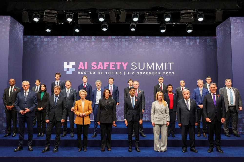 French Minister for Economy Bruno Le Maire, German Economy and Climate Minister Robert Habeck, President of the European Commission Ursula von der Leyen, US Vice President Kamala Harris, Britain's Prime Minister Rishi Sunak, Italy's Prime Minister Giorgia Meloni, United Nations Secretary-General Antonio Guterres, Australia's Defence Minister Richard Marles and others pose for a family photo during the AI Safety Summit in Bletchley Park, near Milton Keynes. - Reuters