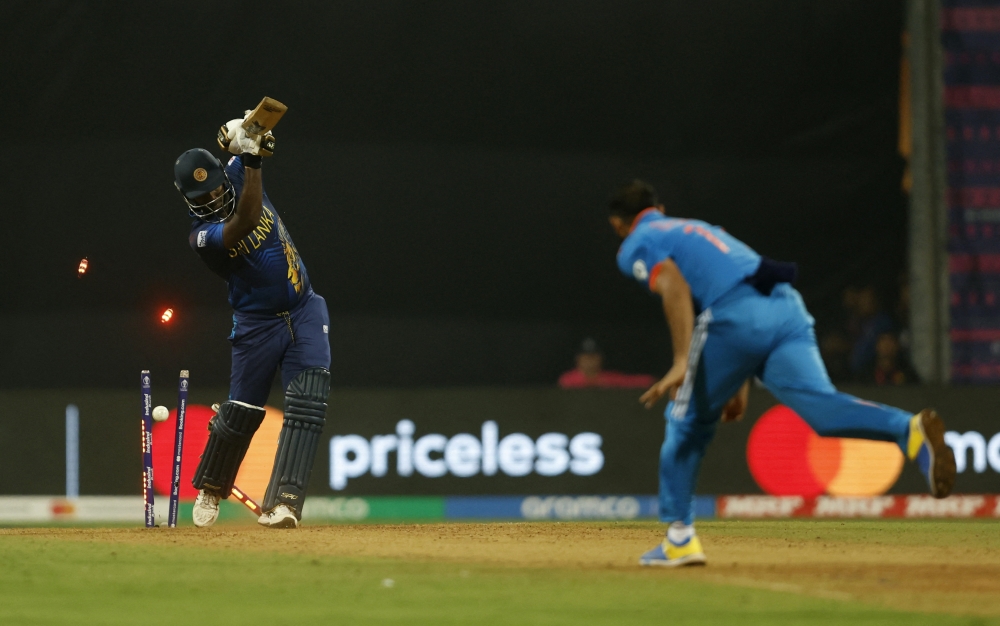 Sri Lanka's Angelo Mathews is bowled out by India's Mohammed Shami 