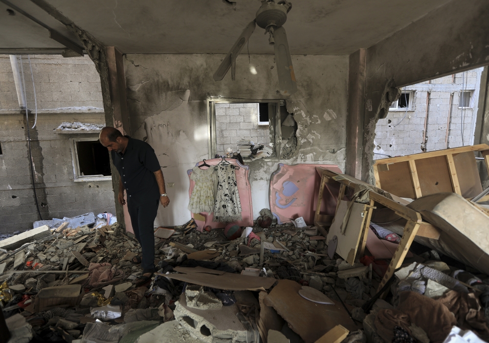 A Palestinian man inspecting damage to a family home in Khan Younis that was hit by Israeli air strikes, in the southern Gaza Strip on Friday, Nov. 3, 2023. (Yousef Masoud/The New York Times)