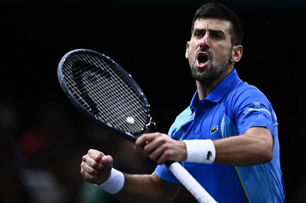 Serbia's Novak Djokovic reacts after winning a game during his men's singles quarter-final match against Denmark's Holger Rune