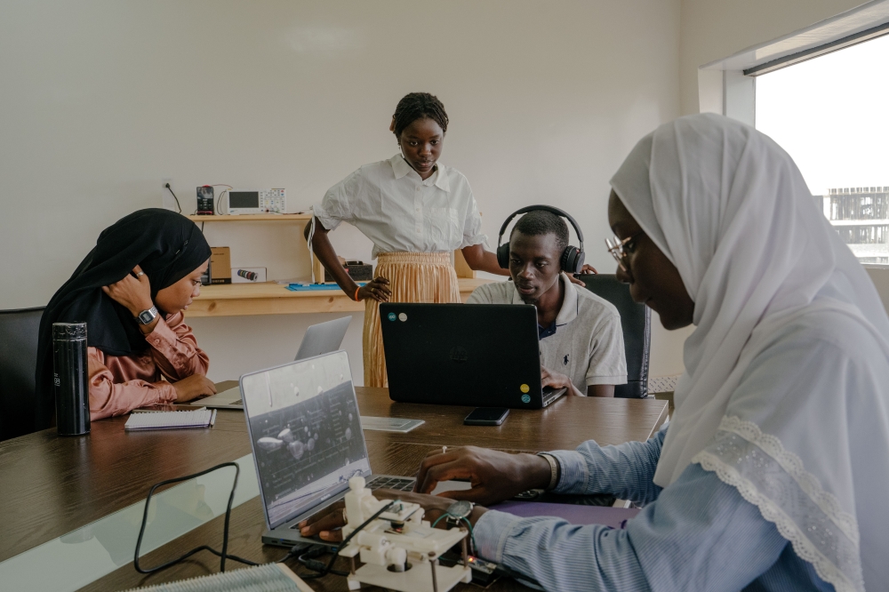Rokhaya Diagne, right, a computer science major, works on a project for her internship at the Institute for Health Research, Epidemiological Surveillance and Training in Dianiamdio, Senegal.
