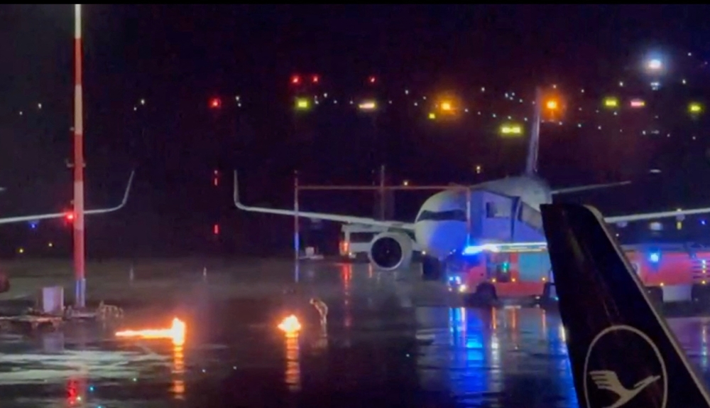 Fire engines arrive at the scene of two small fires at Hamburg Airport 