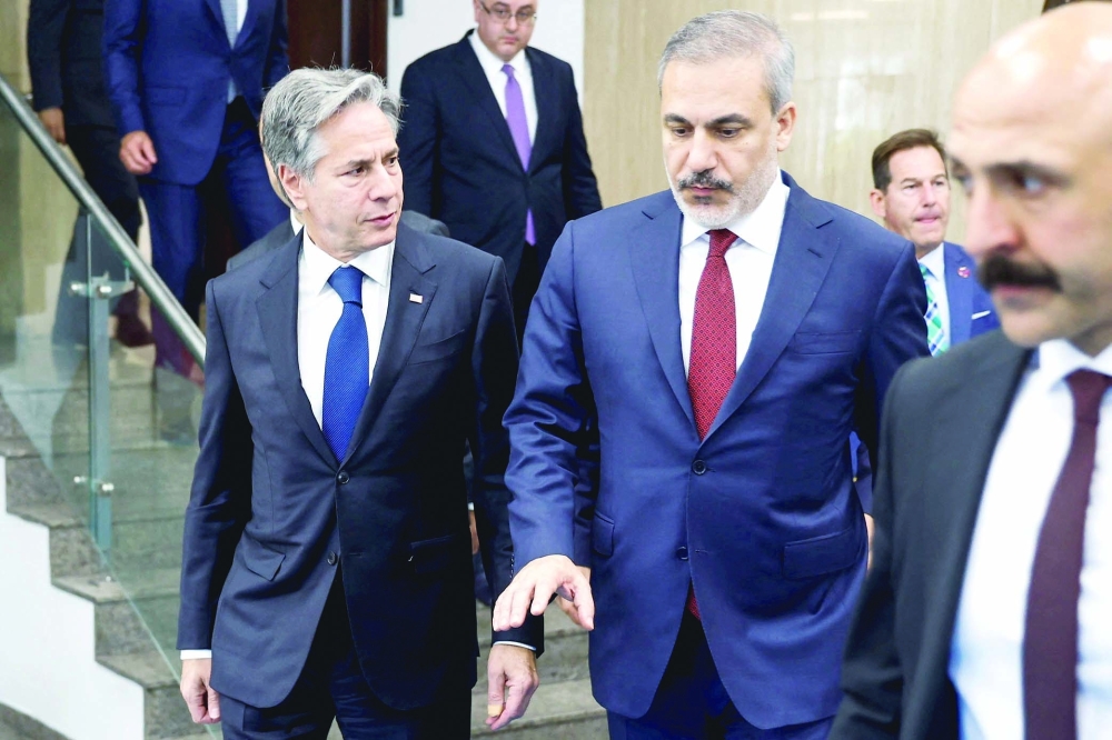 US Secretary of State Antony Blinken walks with Turkish Foreign Minister Hakan Fidan, after their meeting, at the Ministry of Foreign Affairs in Ankara, Türkiye. — Reuters