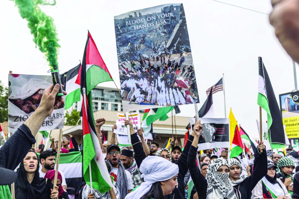 Pro-Palestinian supporters gather during demonstration in front of the US Consulate in Johannesburg, South Africa. — AFP
