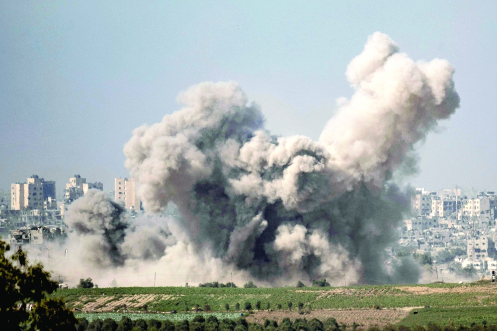 This picture shows smoke rising from northern Gaza after Israeli strikes. — AFP 