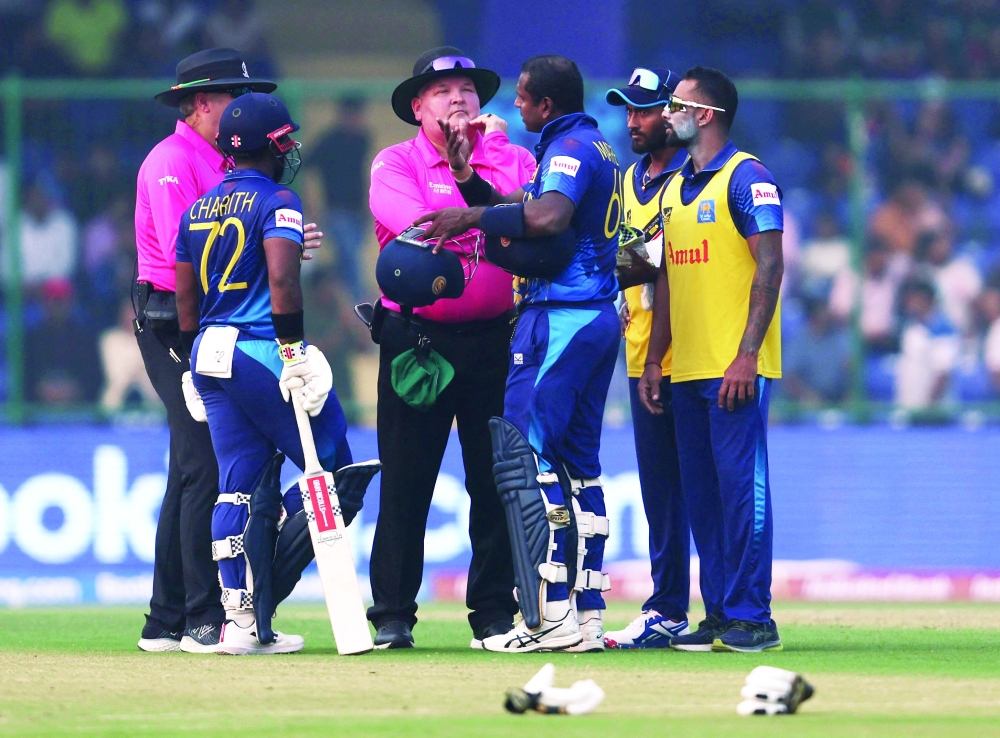 Sri Lanka's Angelo Mathews speaks to the umpires after losing his wicket due to time out REUTERS