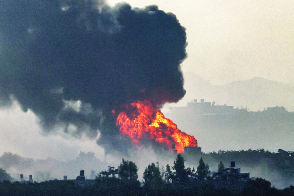A fireball erupts in the Gaza Strip during Israeli bombardment, near a position across the border in southern Israel. — AFP