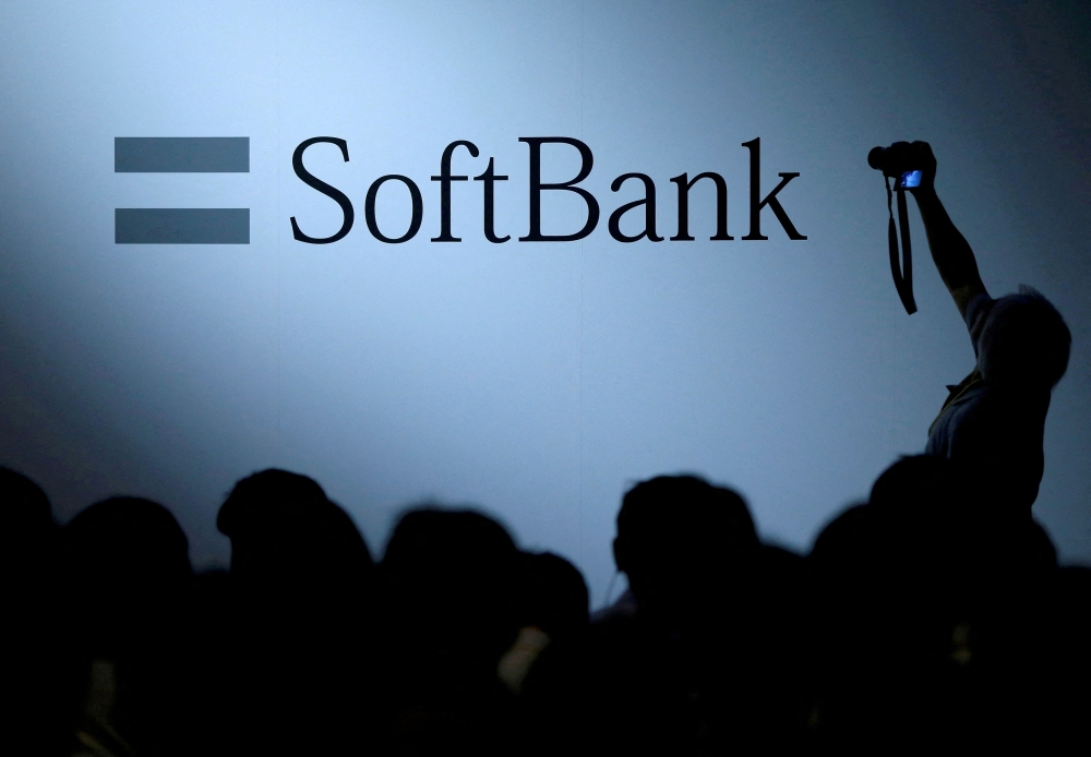 The logo of SoftBank Group Corp is displayed at SoftBank World 2017 conference in Tokyo__REUTERS