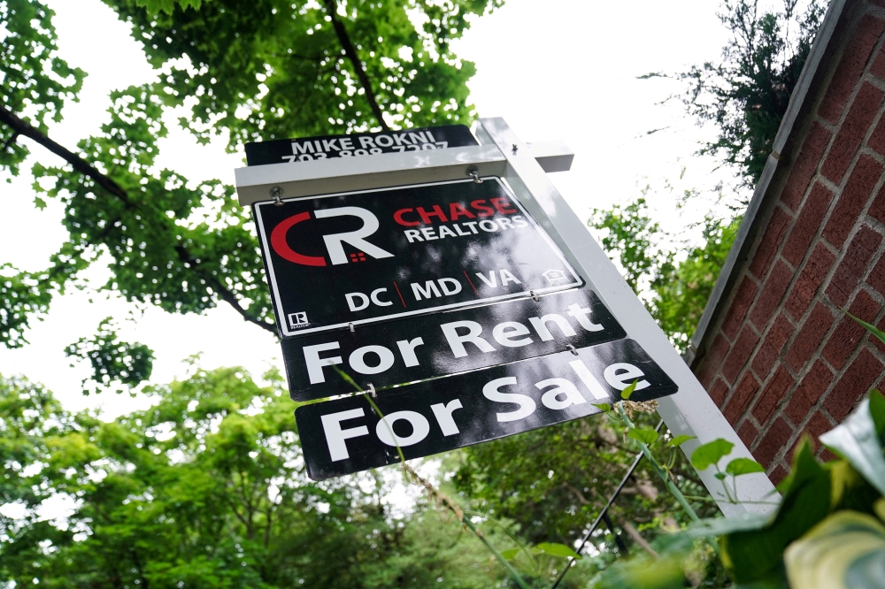 A "For Rent, For Sale" sign is seen outside of a home in Washington__REUTERS