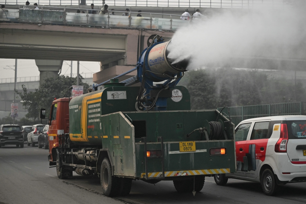 Civic authorities use anti-smog gun amid heavy smog conditions in New Delhi. - AFP 