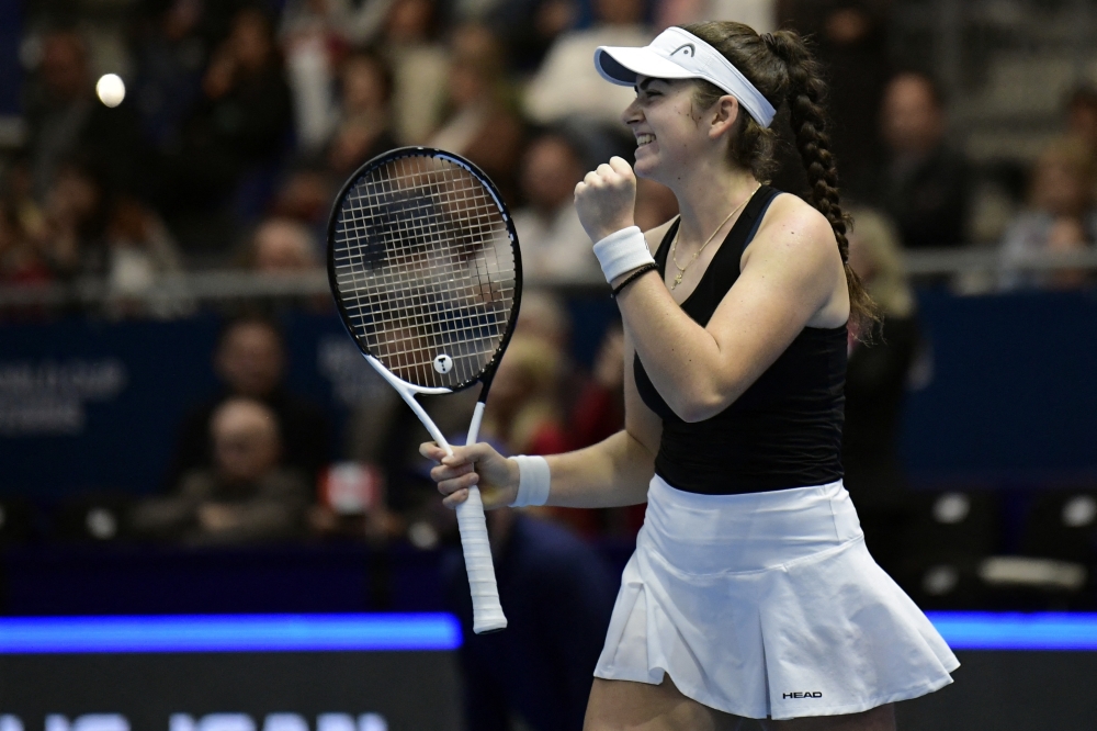 Canada's Marina Stakusic celebrates beating Spain's Rebeka Masarova during the group stage group C singles tennis match between Spain and Canada on the day 2 of the Billie Jean King Cup Finals 2023 in La Cartuja stadium in Seville on November 8, 2023. (Photo by CRISTINA QUICLER / AFP