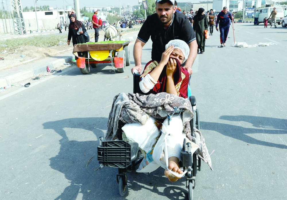 Palestinians fleeing north Gaza move southward, in the central Gaza Strip