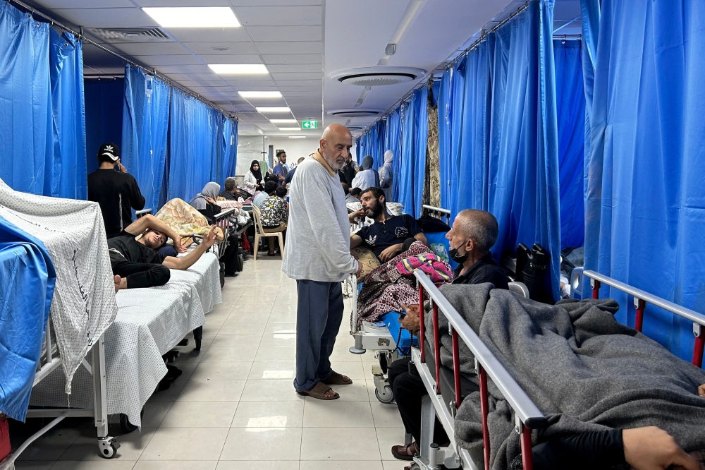 Patients and internally displaced people are pictured at Al-Shifa hospital in Gaza City on November 10, 2023