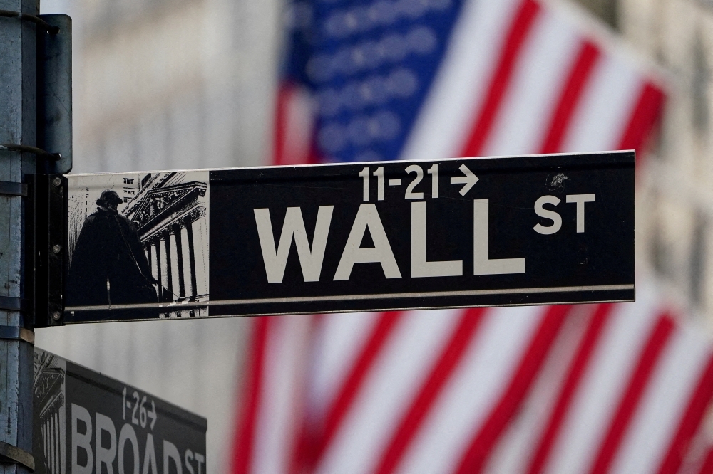 The Wall Street sign is pictured at the New York Stock exchange (NYSE) in New York City, United States — Reuters