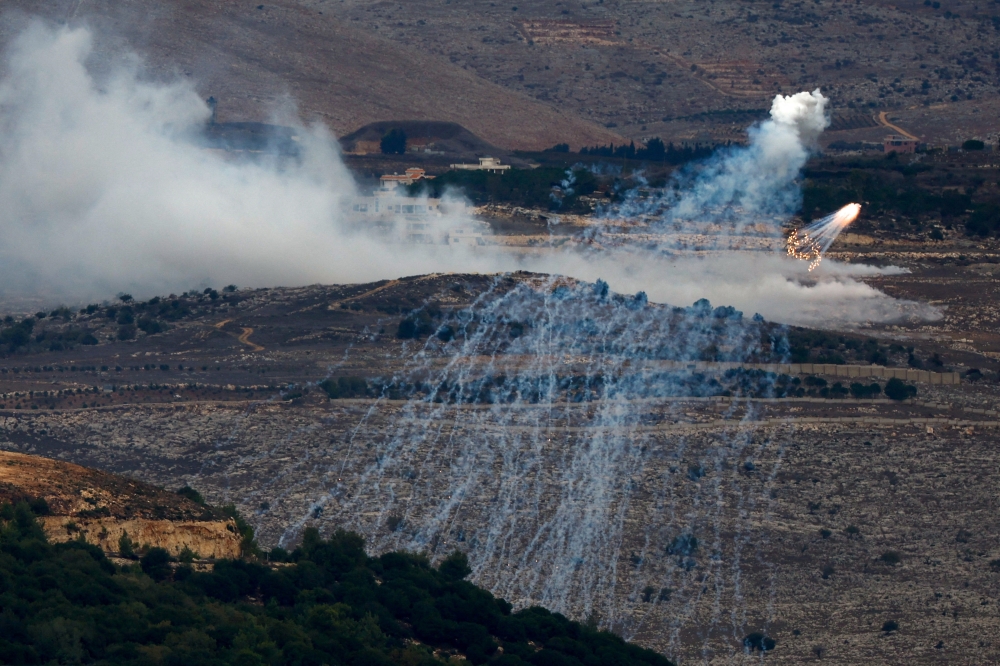White phosphorus fired by Israeli army is seen on the Israel-Lebanon border in northern Israel. — Reuters 