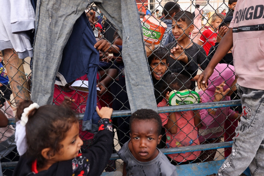 Displaced Palestinian children gather at a refugee camp in Rafah in the southern Gaza Strip. — AFP 