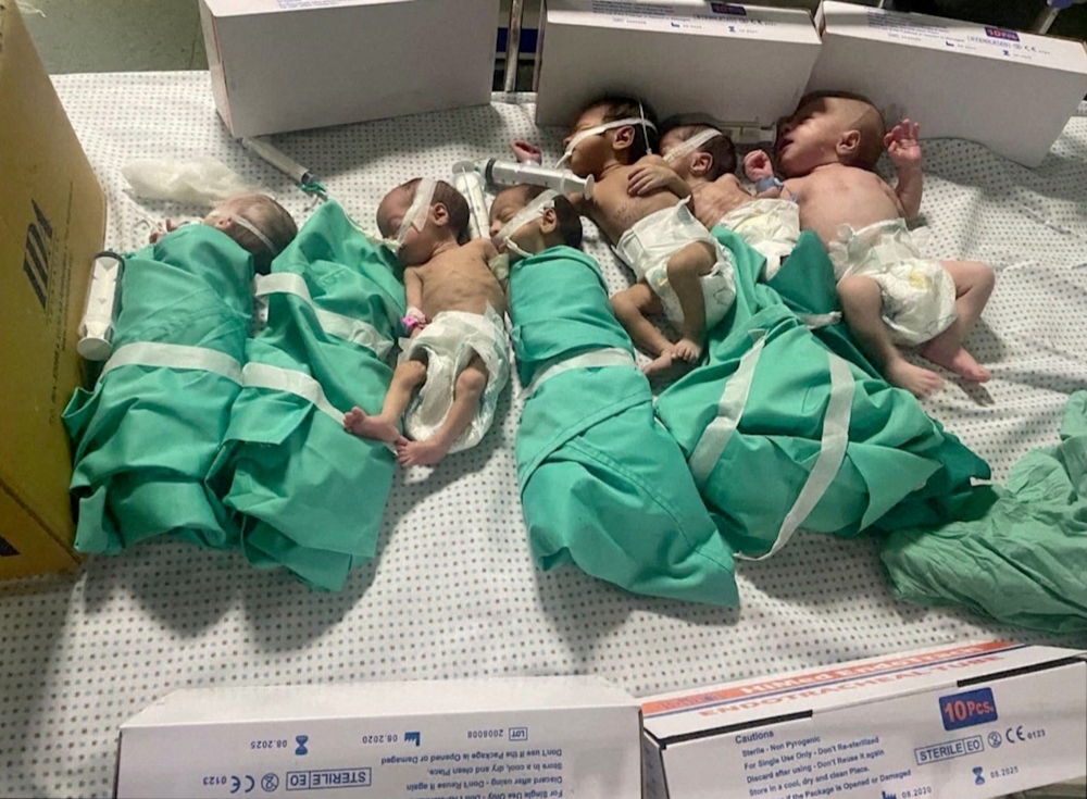 Newborns are placed in bed after being taken off incubators in Gaza's Al Shifa hospital after power outage