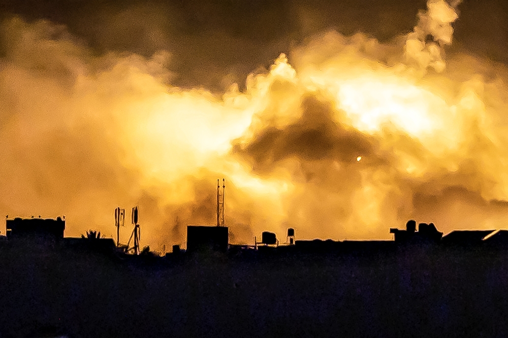 Explosions erupt during Israeli bombardment in the northern Gaza Strip near a position along Israel's southern border on November 12, 2023 amid ongoing battles between Israel and the Palestinian Hamas movement.  (Photo by FADEL SENNA / AFP)

