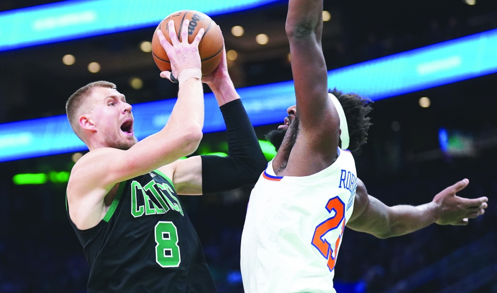 Kristaps Porzingis (8) shoots against Mitchell Robinson (23) at TD Garden.— USA TODAY Sports
