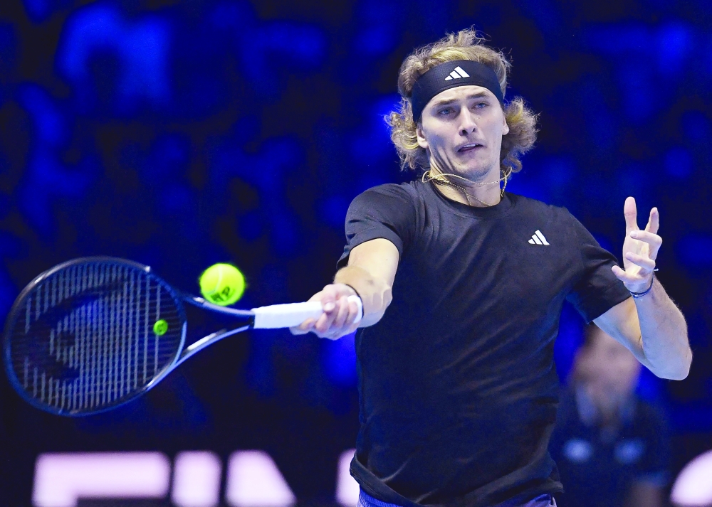 Germany's Alexander Zverev returns to Spain's Carlos Alcaraz at the ATP Finals in Turin.— AFP


