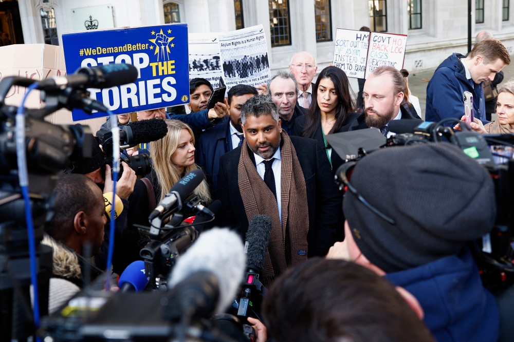 Toufique Hossain representing asylum seekers, speaks to the media outside the Supreme Court following its ruling on whether the government can go ahead with its plan to deport migrants to Rwanda, in London, Britain, November 15, 2023. REUTERS/Peter Nicholls
