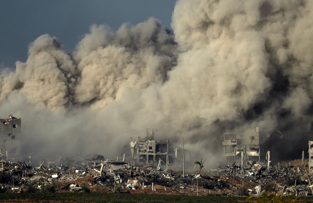TOPSHOT - Smoke rises during an Israeli military bombardment of the northern Gaza Strip on November 15, 2023, amid the ongoing battles between Israel and the Palestinian group Hamas. Thousands of civilians, both Palestinians and Israelis, have died since October 7, 2023, after Palestinian Hamas militants based in the Gaza Strip entered southern Israel in an unprecedented attack triggering a war declared by Israel on Hamas with retaliatory bombings on Gaza. (Photo by FADEL SENNA / AFP)


