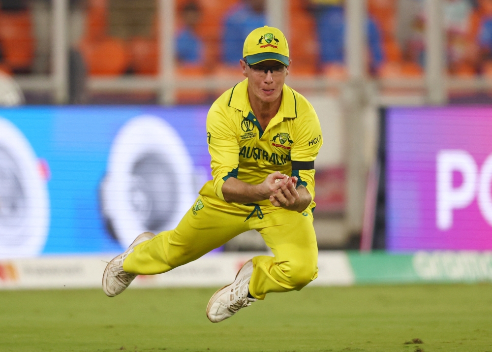  Adam Zampa takes the catch to dismiss England's David Willey, off the bowling of Josh Hazlewood. — Reuters