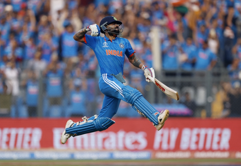 Cricket - ICC Cricket World Cup 2023 - Semi-Final - India v New Zealand - Wankhede Stadium, Mumbai, India - November 15, 2023 India's Virat Kohli celebrates after reaching his 50th century, breaking Sachin Tendulkar's record of most number of ODI centuries REUTERS/Adnan Abidi
