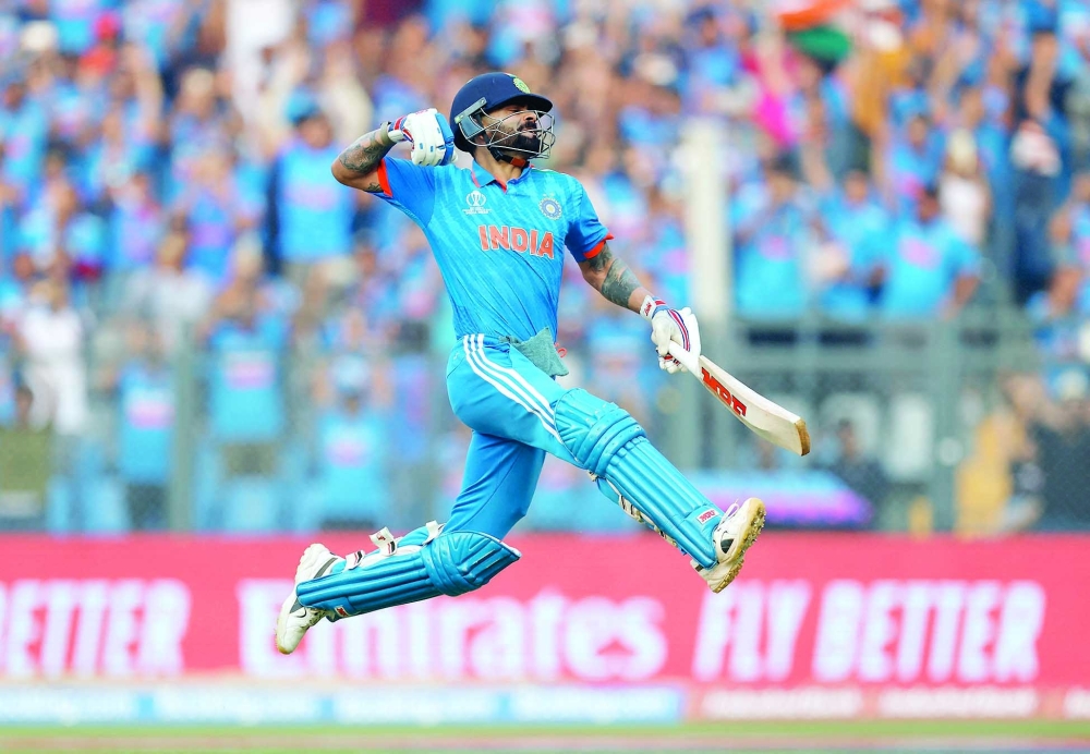 Cricket - ICC Cricket World Cup 2023 - Semi-Final - India v New Zealand - Wankhede Stadium, Mumbai, India - November 15, 2023 India's Virat Kohli celebrates after reaching his 50th century, breaking Sachin Tendulkar's record of most number of ODI centuries REUTERS/Adnan Abidi
