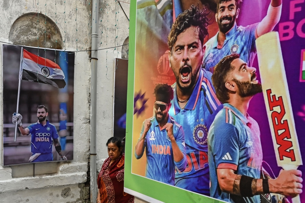 Posters of team India's players along a street in Kolkata 