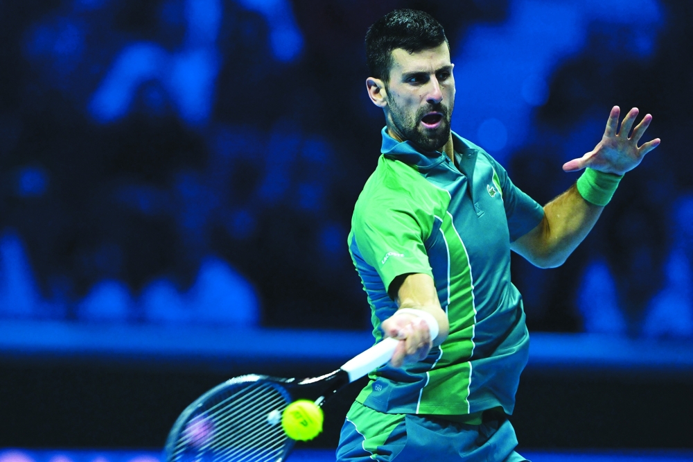 Novak Djokovic returns to Spain's Carlos Alcaraz during the semi-final match.— AFP)

