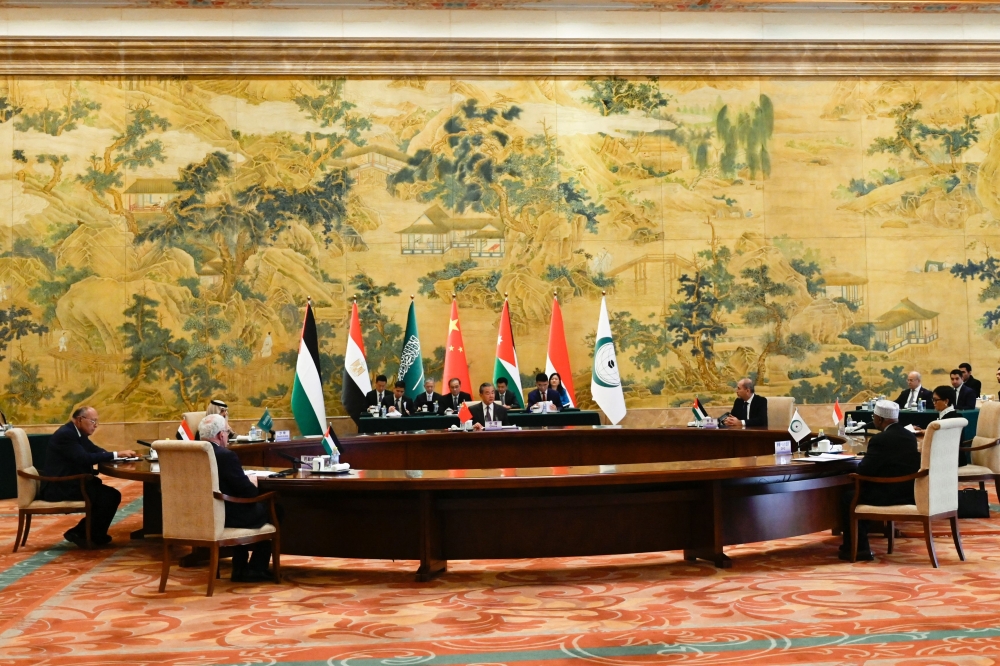 China's Foreign Minister Wang Yi (C) and Arab and Muslim ministers attend a meeting for foreign ministers from Arab and Muslim-majority nations at the Diaoyutai State Guest House in Beijing. — AFP