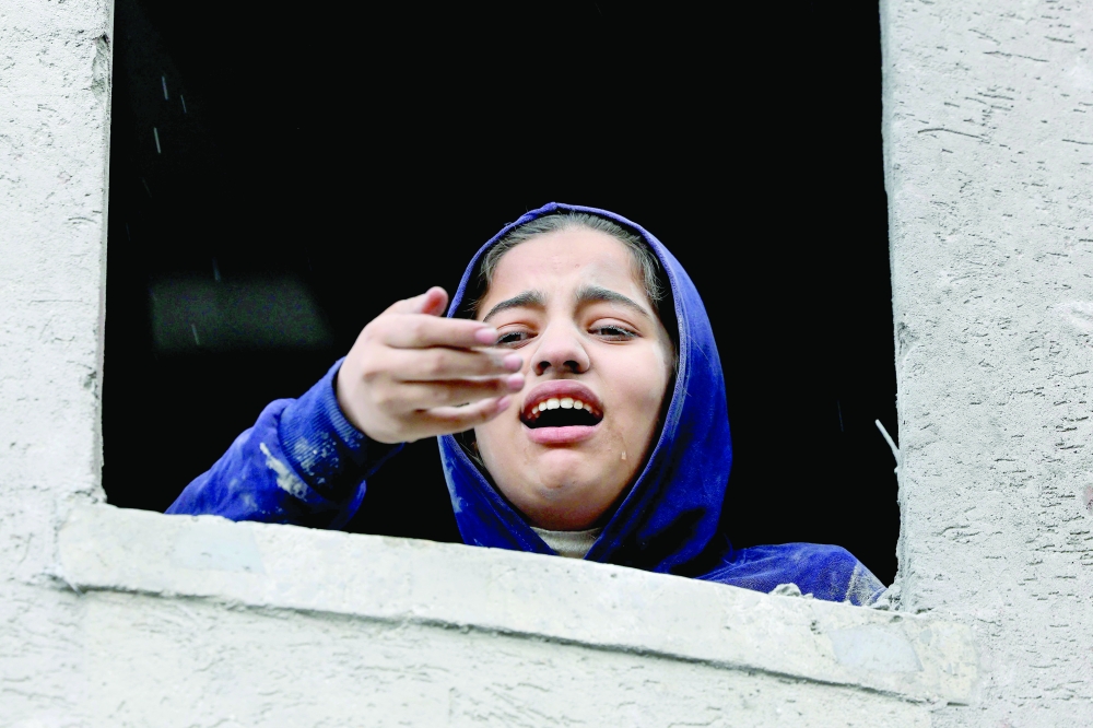 A Palestinian girl reacts following an Israeli strike on Rafah in the southern Gaza Strip on Monday. - AFP