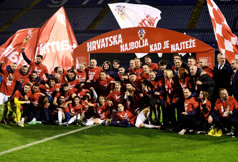 Croatia's players celebrate qualifying after the UEFA Euro 2024 Group D qualification football match between Croatia and Armenia at the Maksimir Stadium in Zagreb, on November 21, 2023.  (Photo by DENIS LOVROVIC / AFP)

