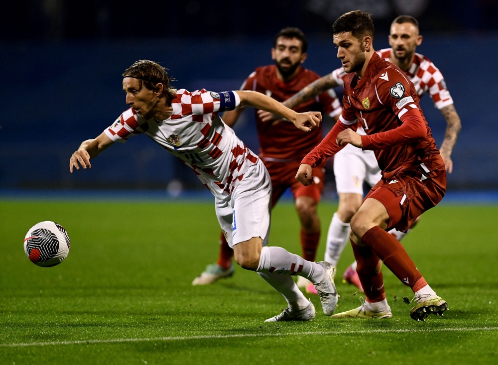 Croatia's midfielder #10 Luka Modric (L) challenges Armenia's defender #05 Styopa Mkrtchyan during the UEFA Euro 2024 Group D qualification football match between Croatia and Armenia at the Maksimir Stadium in Zagreb, on November 21, 2023.  (Photo by DENIS LOVROVIC / AFP)

