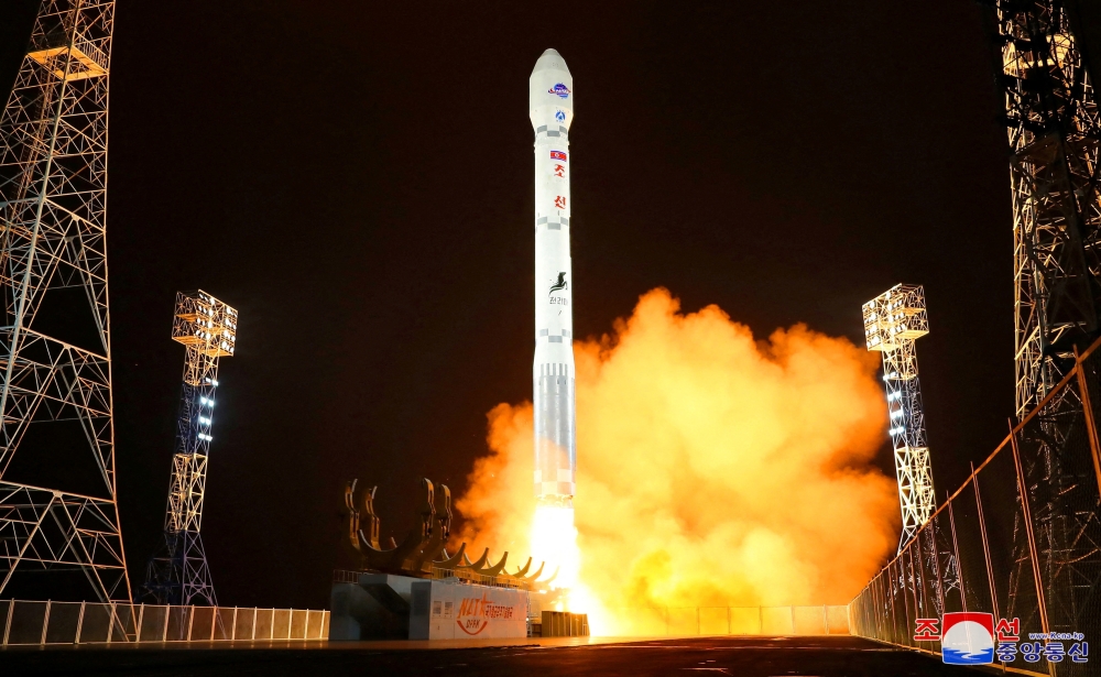 A rocket carrying a spy satellite Malligyong-1 is launched in a location given as North Gyeongsang Province, North Korea. - Reuters 