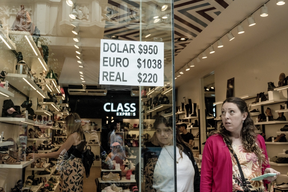 A shop displaying the day’s exchange rates for the dollar, euro, and the Brazilian real for customers who want to pay in foreign currency in Buenos Aires, Argentina, on Nov. 21, 2023. (Anita Pouchard Serra/The New York Times)